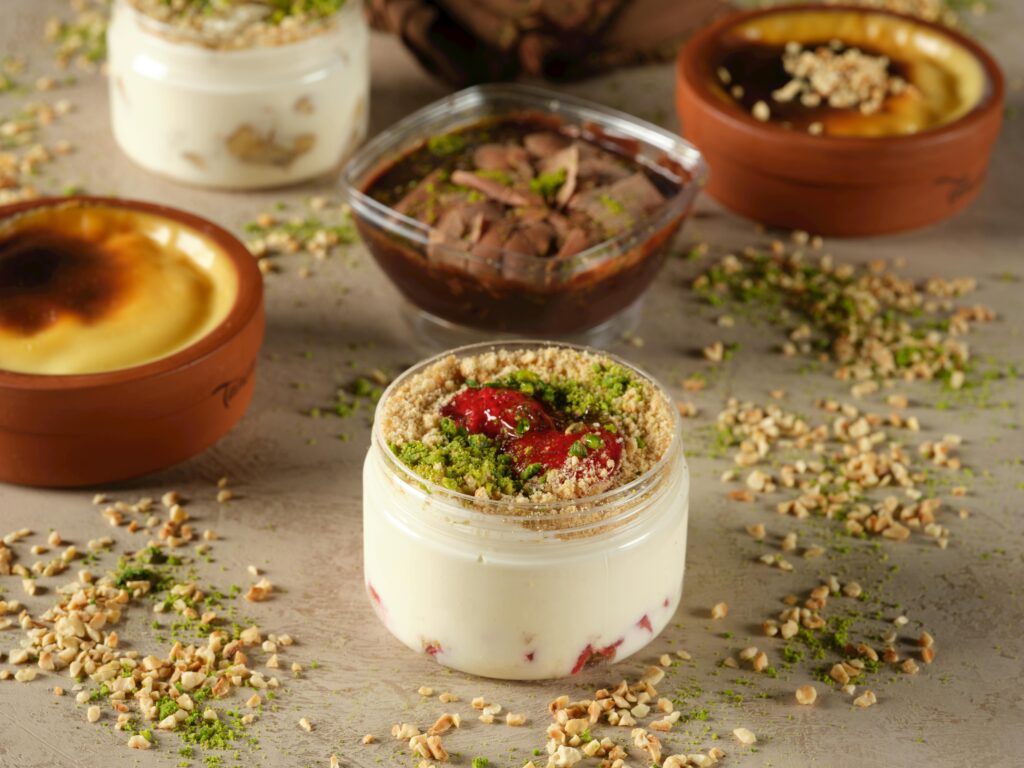 Close-up of assorted Turkish desserts including nuts and sweets, showcasing rich cultural flavors.
